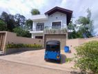 වෙල්‍යායකට මුහුන්ලා පිහිටි අලුතින්ම ඉදිකරන ලද දෙමහල් නිවස විකිනීමටAxxiz)