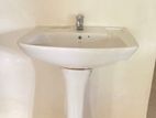 Wash basin with fittings