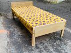 Wooden bed with mattress