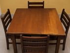 Wooden dining table with 4 striped chairs